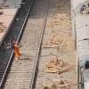 Freight Negligence Triggers Horrific Accident as Train-Propelled Timber Critically Injures Commuter