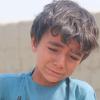 Grief Amid the Rubble: Afghan Boy’s Viral Loss Highlights Human Toll of Cross-Border Strikes