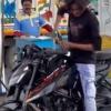 Man Washes Bike with Petrol at Fuel Station, Viral Video Sparks Outrage Over Waste and Safety Risks