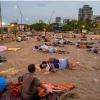 Mumbai Heatwave Forces Slum Families to Take Shelter on Versova Beach Amid Severe Power Cuts