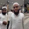 Woman Challenges Rose Petal Welcome for Hajj and Umrah Pilgrims at Indian Airport