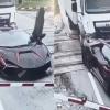 Truck Pushes Stranded Lamborghini Off Railway Tracks Moments Before Train Arrives