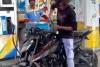 Man Washes Bike with Petrol at Fuel Station, Viral Video Sparks Outrage Over Waste and Safety Risks