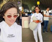 Sneha Ullal Turns Heads with Sophisticated Airport Appearance in Mumbai