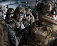 US Military Build-Up Intensifies as USS Tripoli Deployment and Viral Video Spark Attention