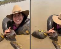 Woman Calmly Embraces Giant Green Anaconda in Amazon River, Video Sparks Widespread Reaction