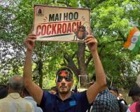 COCKROACH JANTA PARTY STAGES MASSIVE DELHI PROTEST, DEMANDS EDUCATION MINISTER'S RESIGNATION
