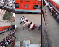 Railway Officers Use Batons to Maintain Order in Crowded Queue at Indian Railway Station
