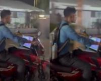 Hyderabad Motorcyclist Seen Riding with Open Laptop on Fuel Tank Sparks Online Outrage Over Work Culture and Road Safety Concerns