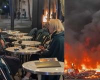 Paris Couple Sips Drinks as Fires Rage Nearby During Violent Protests