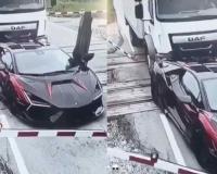 Truck Pushes Stranded Lamborghini Off Railway Tracks Moments Before Train Arrives