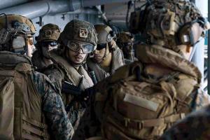 US Military Build-Up Intensifies as USS Tripoli Deployment and Viral Video Spark Attention