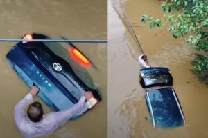 Man Clings to Submerged Tata Nexon EV During Flood, Video Shows Emotional Bond With Vehicle